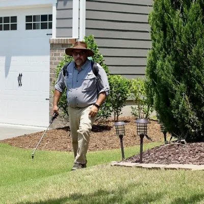 Service technician spraying weeds
