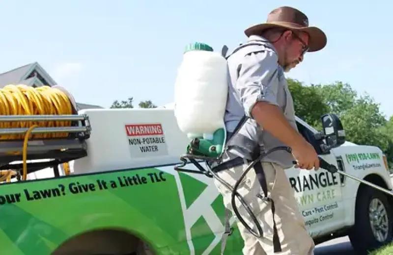 Tech spraying weeds
