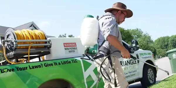 Tech spraying weeds